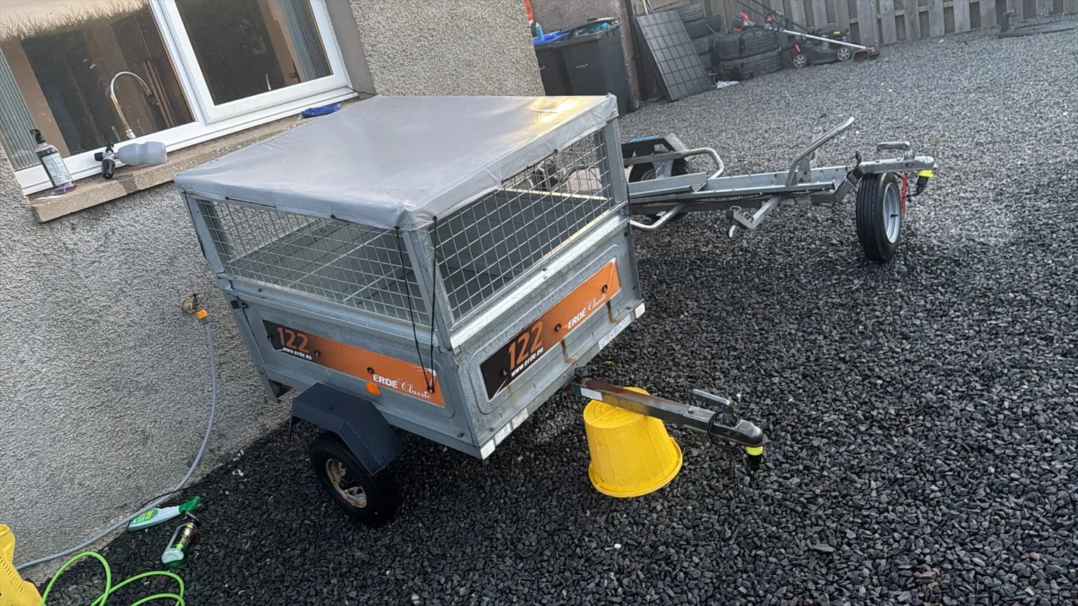 Covered cage trailer side view