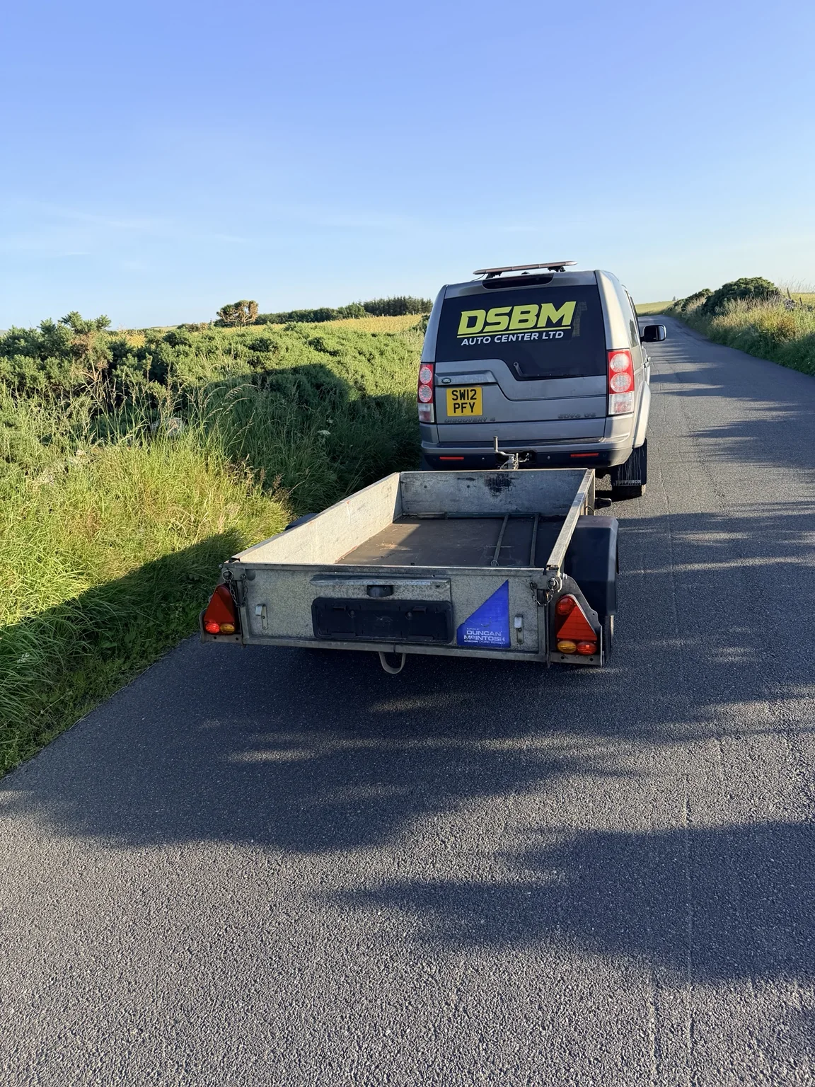 DSBM Hire flatbed trailer being towed near Fraserburgh